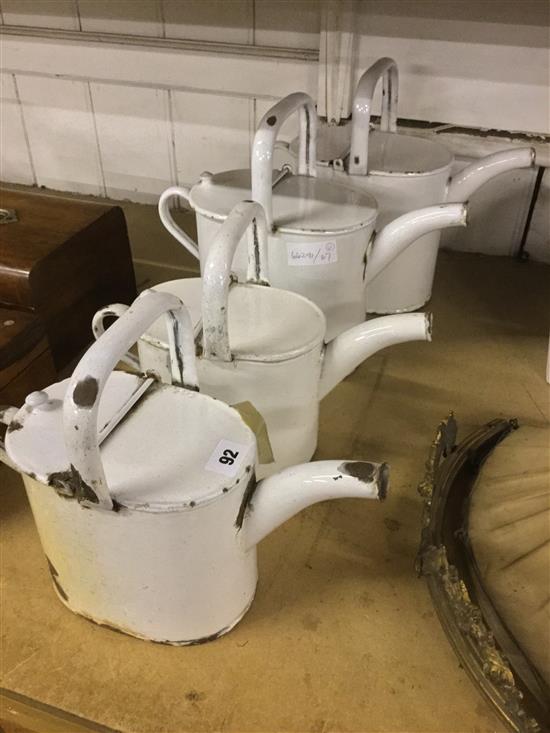 4 white enamel watering cans